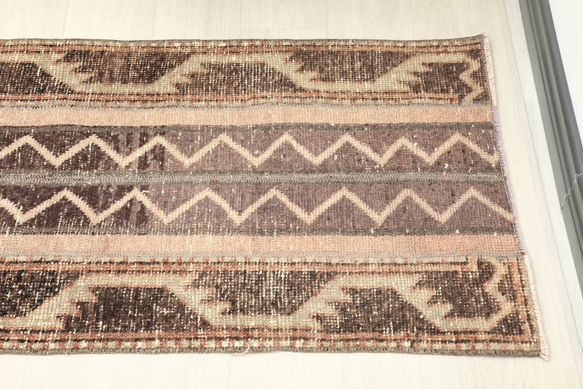 Angled view of the other end of the runner, showing consistent patterning and aged appearance
