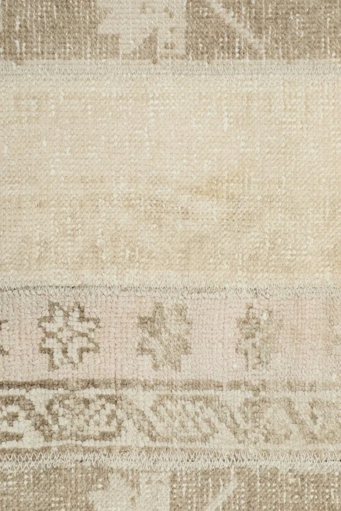 Close-up of the central section, focusing on a cream panel and a strip with small repeating tribal motifs.