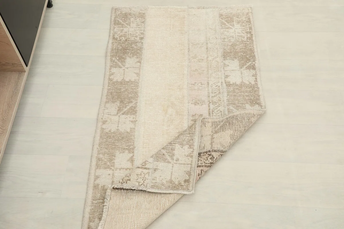 The rug partially folded, demonstrating its flexibility and construction.