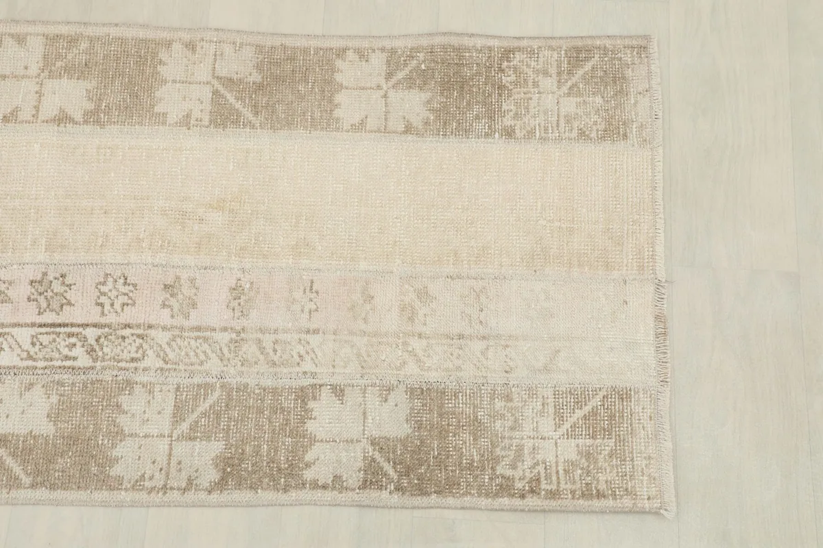 Close overhead view highlighting the varied panels and textures within the rug's design.