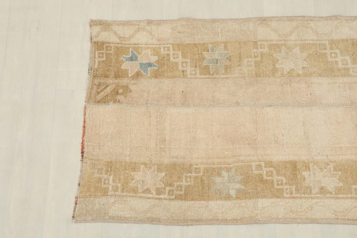 Close-up of the other end of the rug, showing the colors and the hand-knotted wool pile.
