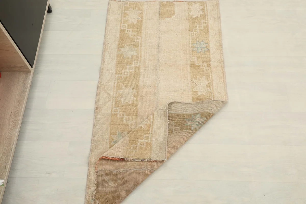 The rug partially folded, demonstrating its flexibility and the overall size.