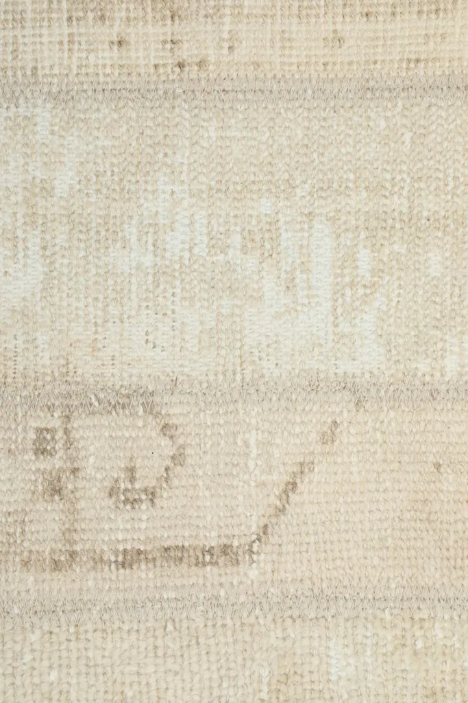 Extreme close-up of a specific tribal motif within the rug's design