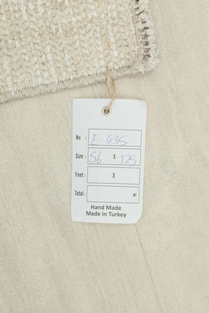 Tag showing the rug's size in centimeters and origin as hand made in Turkey