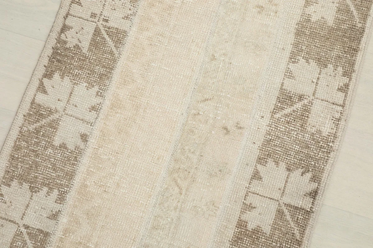 Close-up of the beige and tan striped pattern, highlighting texture and color variations.