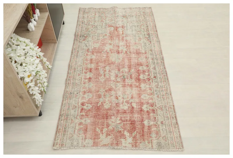 Full overhead view of the 3'1" x 6'3" vintage Anatolian rug with faded rose and beige floral pattern.
