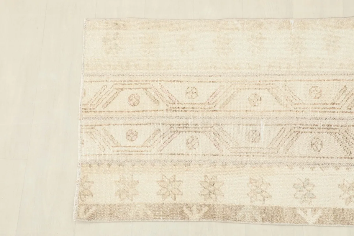 Detailed view showing the subtle color variations and motifs in the rug
