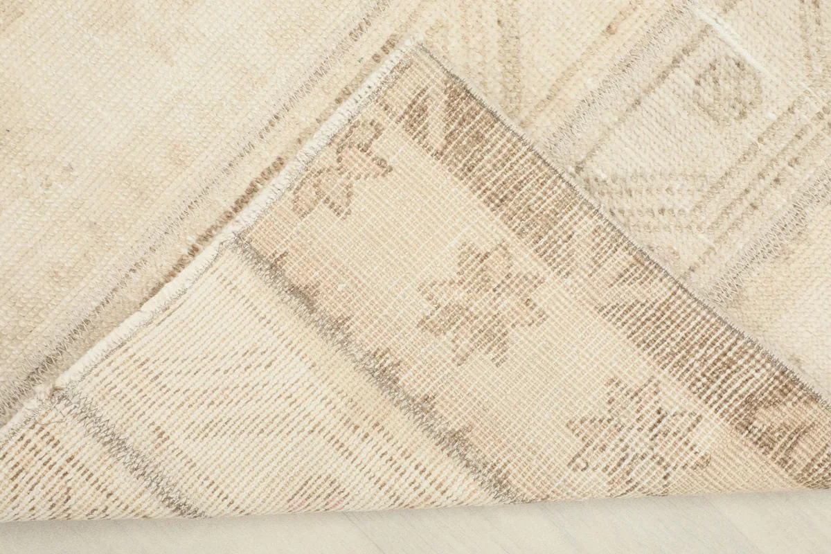 View of the back of the hand-knotted wool rug, showing cotton foundation