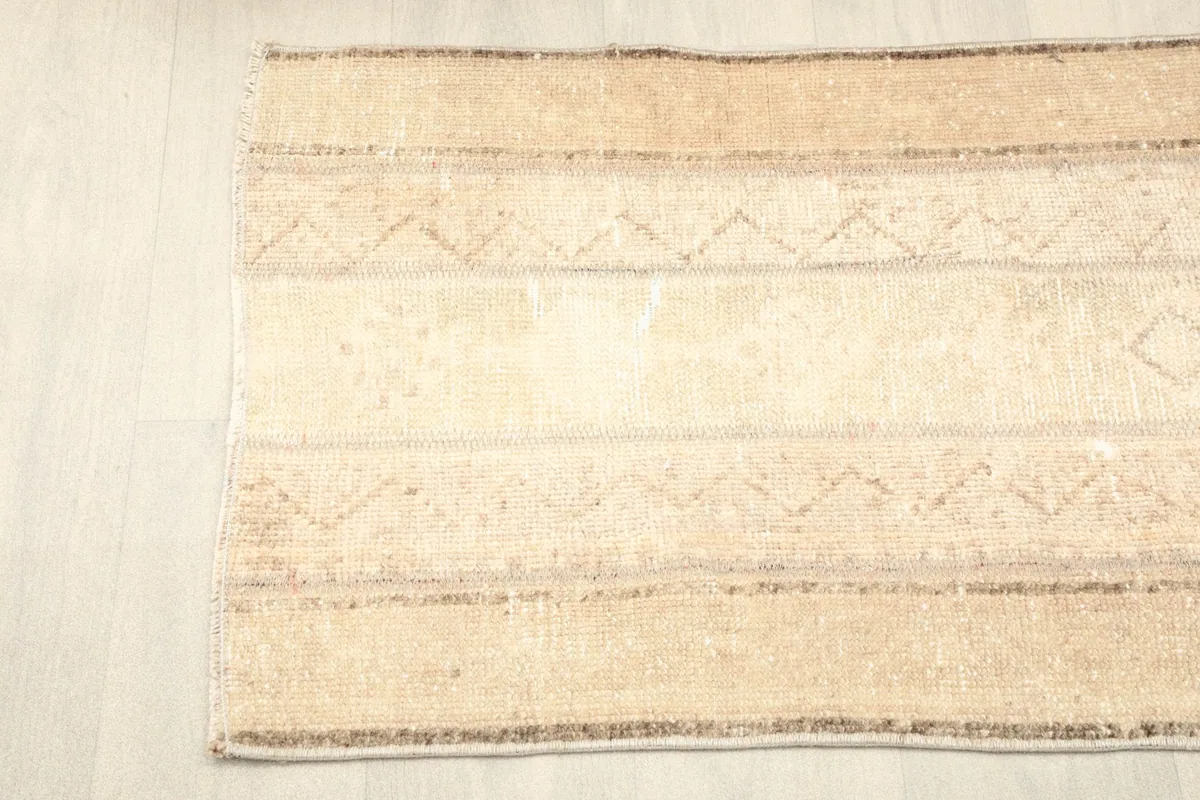 Angled top-down view of the rug's patterns and natural fiber texture
