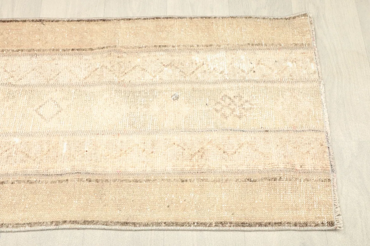 Close-up of the varied geometric and tribal patterns across the rug's surface