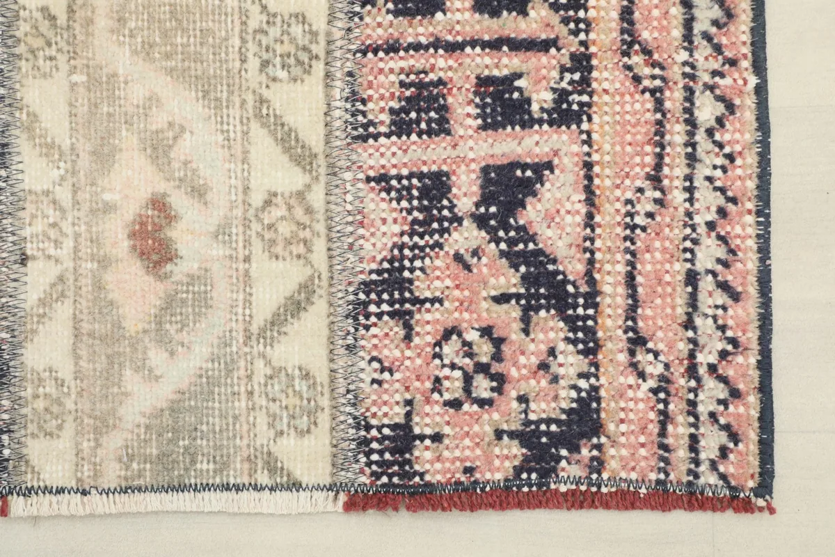 Close-up of the rug's edge, showing the woven texture and a subtle fringe detail.