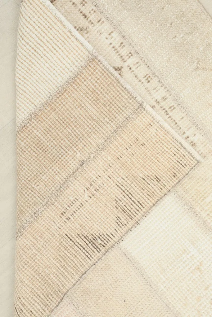 Underside view of the rug, showing the cotton foundation and hand-knotted construction