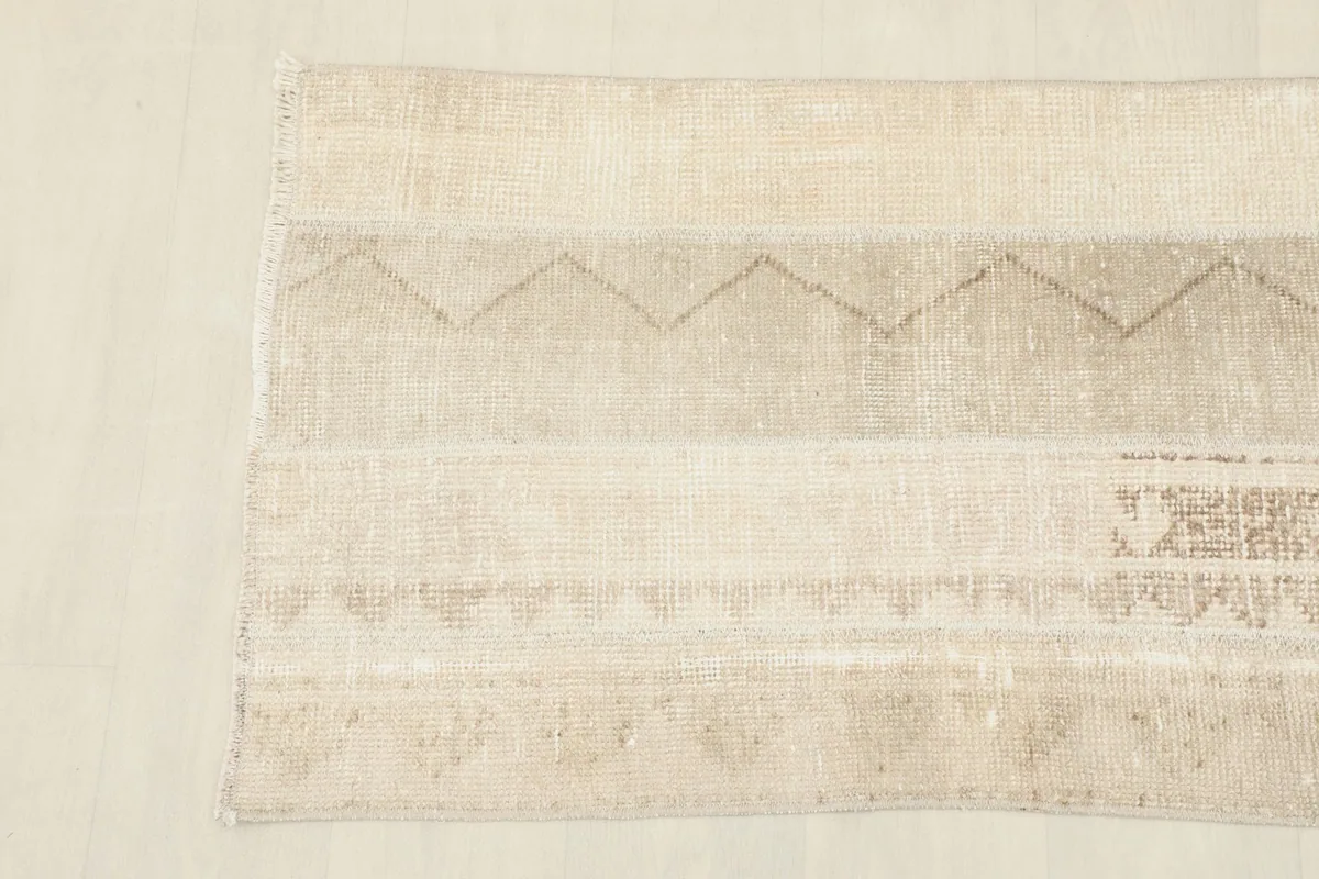 Detail view of the other end of the runner, showing the subtle variations in the vintage wool pile.
