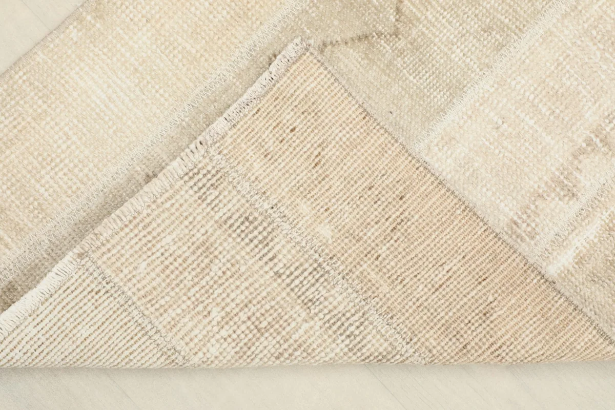 View of the cotton foundation from the back of the hand-knotted vintage Anatolian rug.