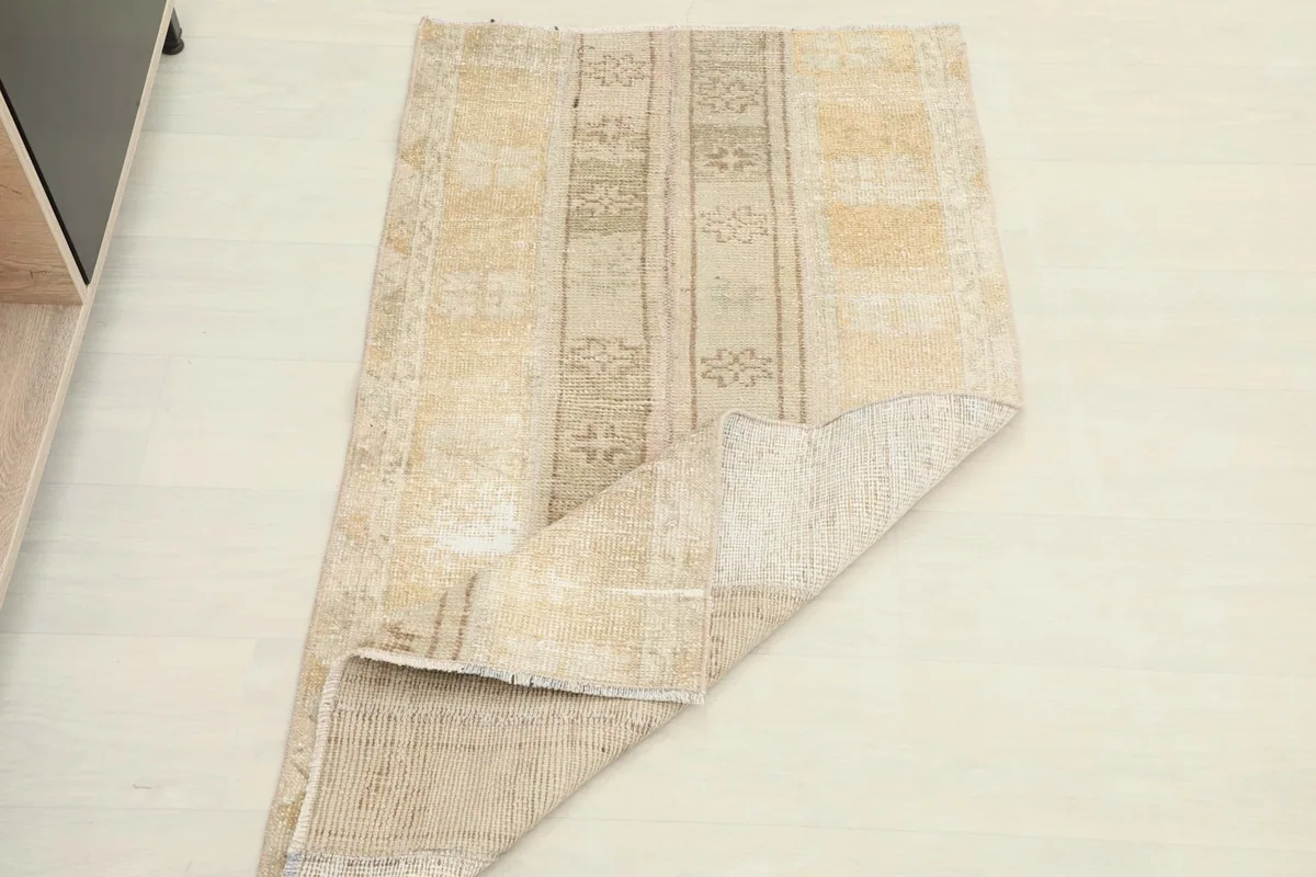 Rug partially folded to show its flexibility and overall appearance from a different angle