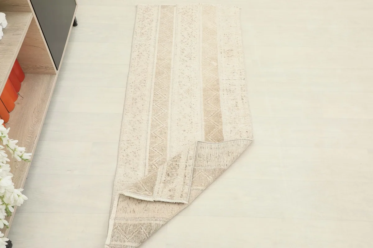The runner partially folded, showcasing its flexibility and full length in the room setting.