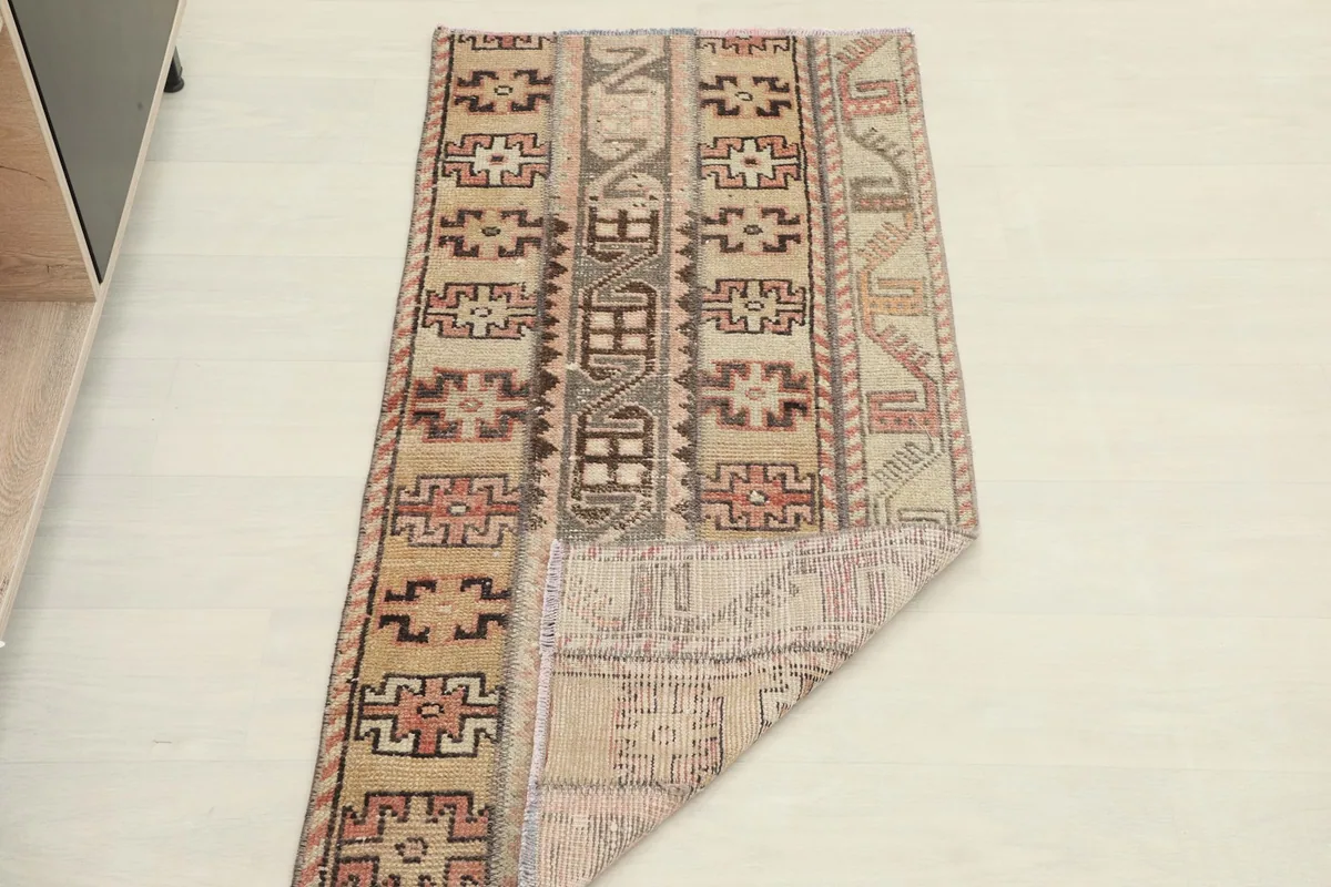 Rug partially folded to show both the front and back, illustrating its flexibility