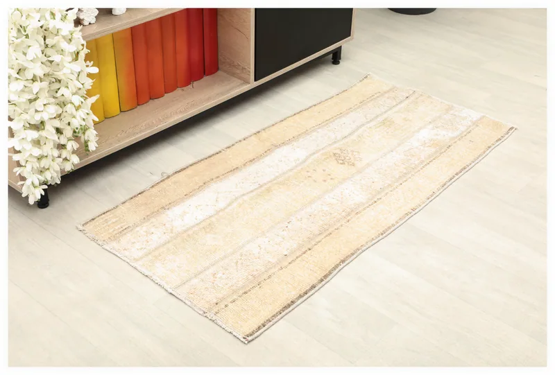 Full top view of a 2x4 beige and tan striped vintage Anatolian rug on a white background.