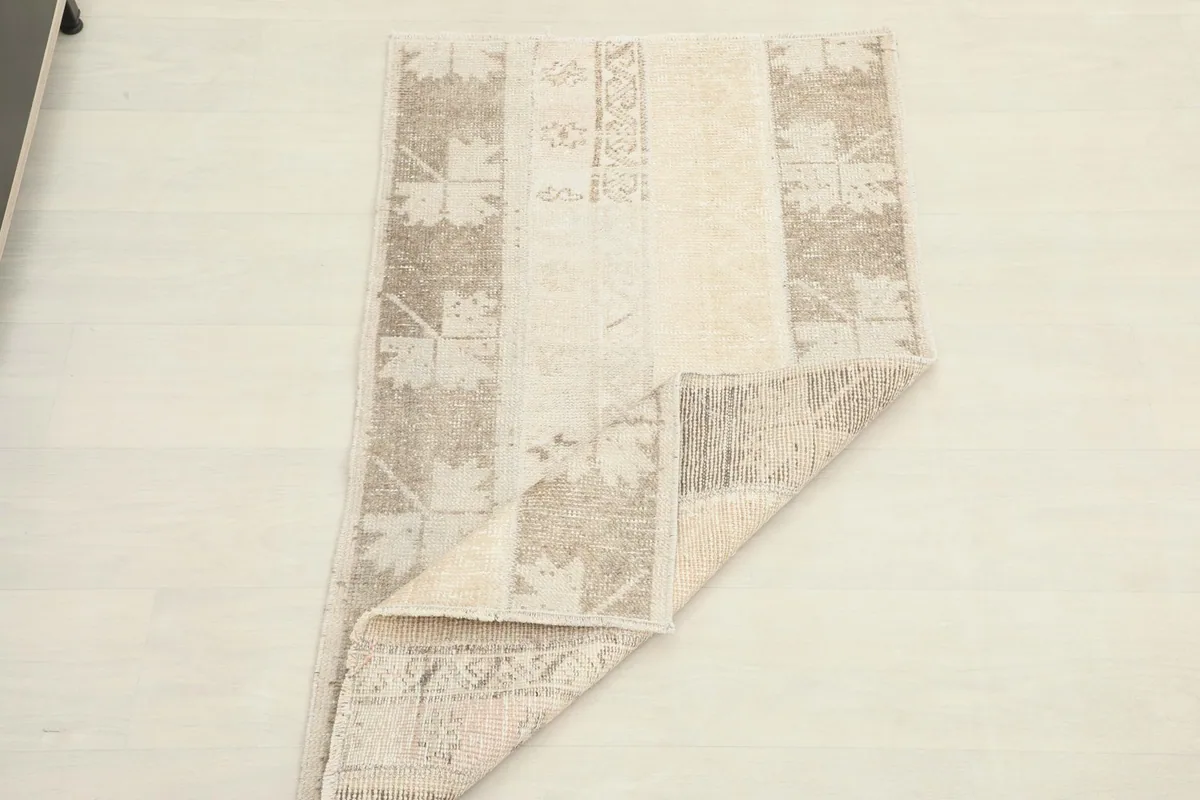 The rug folded to demonstrate its flexibility and thickness