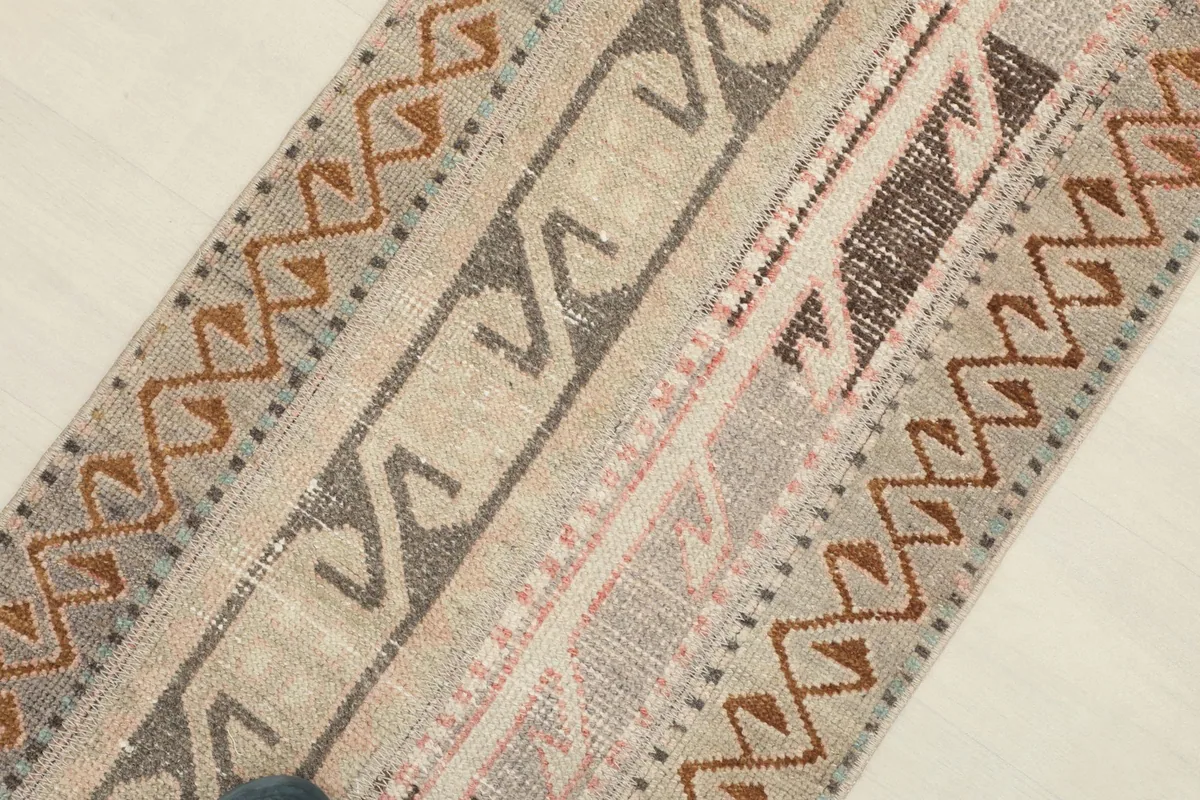 Detailed view of the rug's surface, capturing the texture and various patterns.