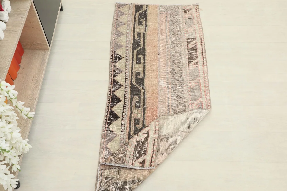 The runner partially folded, illustrating its flexibility and the overall design from a different perspective.