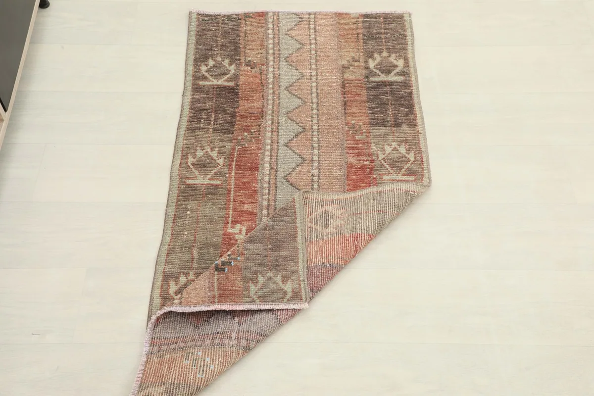 The rug partially folded, illustrating its flexibility and overall size.