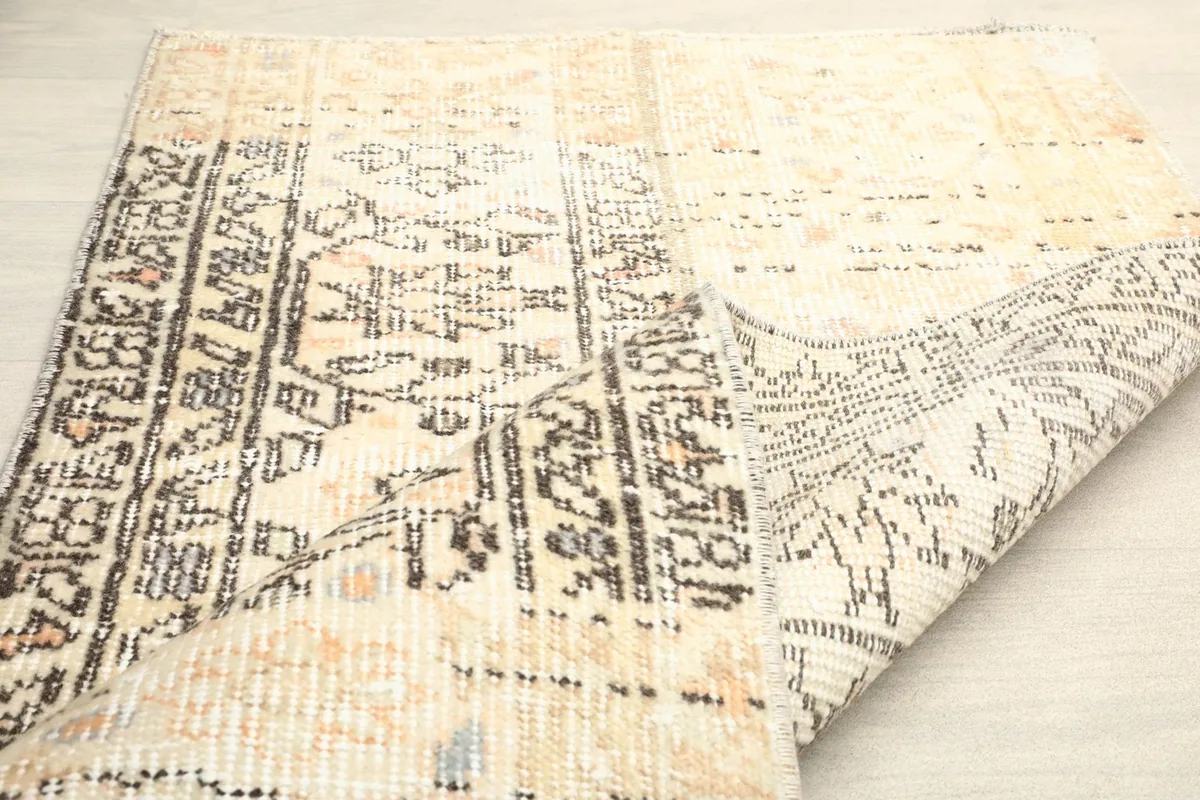 View of the rug's back and foundation, demonstrating the hand-knotted craftsmanship.