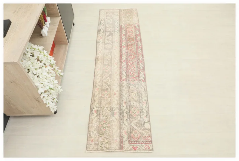 Full overhead view of the 1'9" x 6'6" vintage Anatolian patchwork runner rug on a white background.