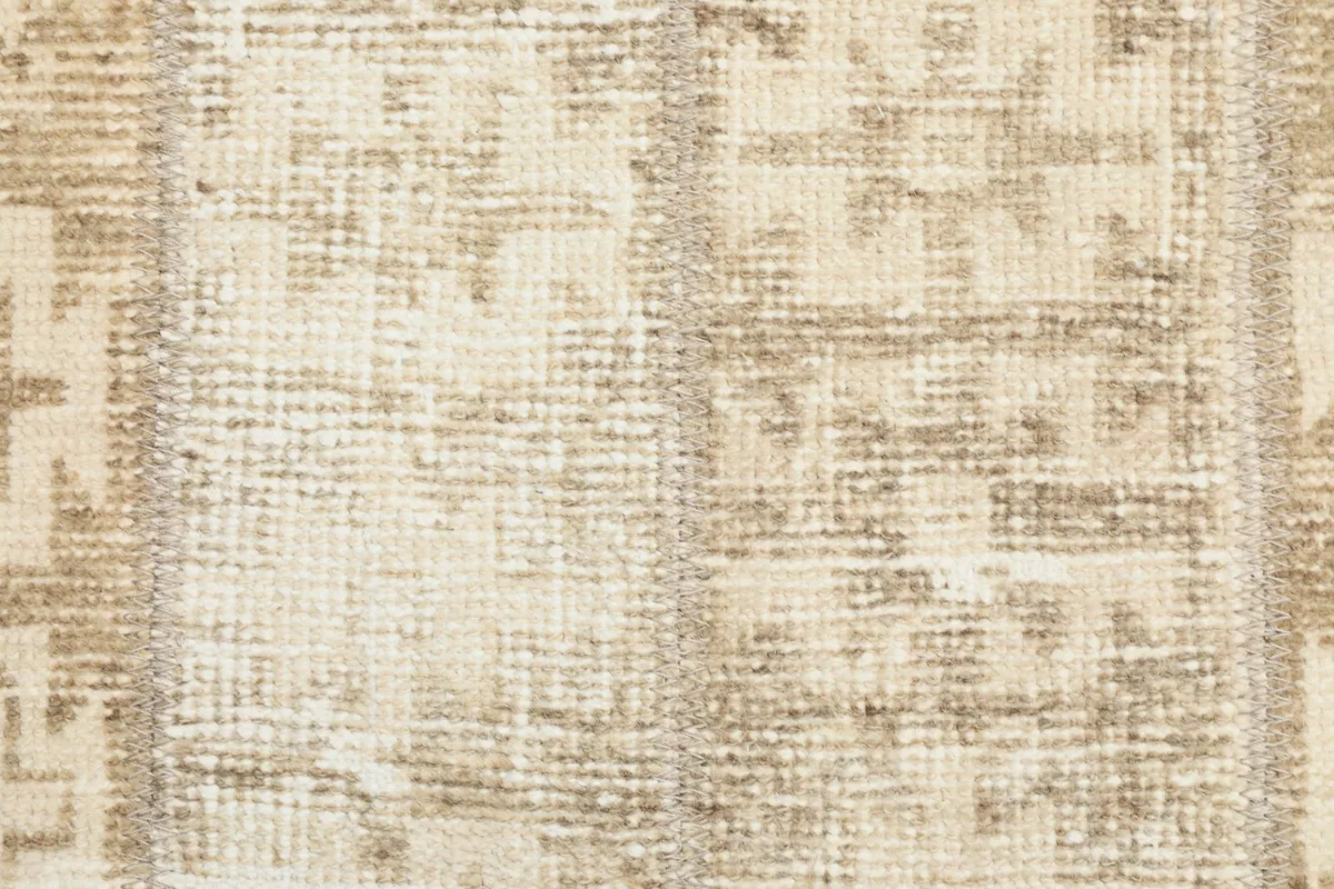 Very close detail of the hand-knotted wool pile and cotton foundation, showing individual knots.