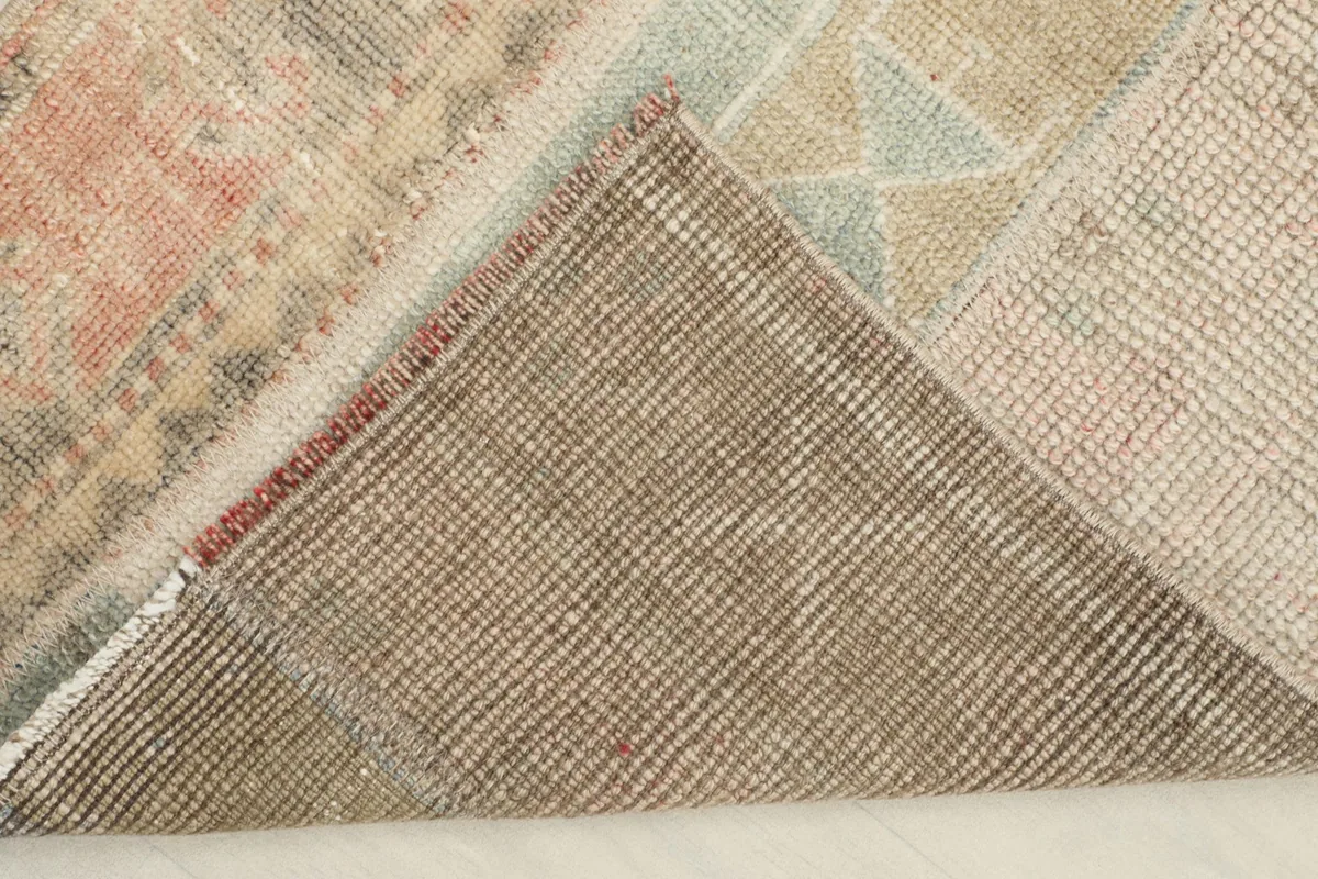 View of the cotton foundation from the back of the rug, revealing the tight hand-knotting and craftsmanship.
