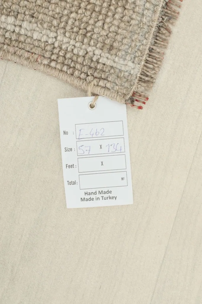 Tag displaying the rug's dimensions and origin, confirming it is a hand-made product from Turkey.