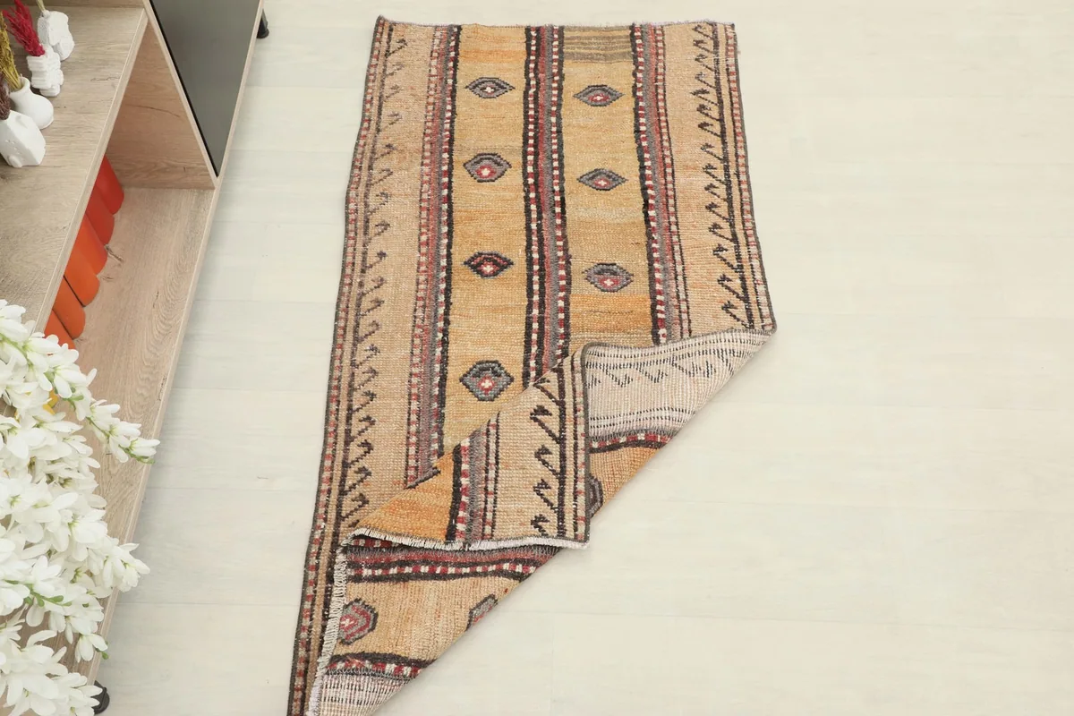 Rug folded to show its flexibility and the consistent pattern.