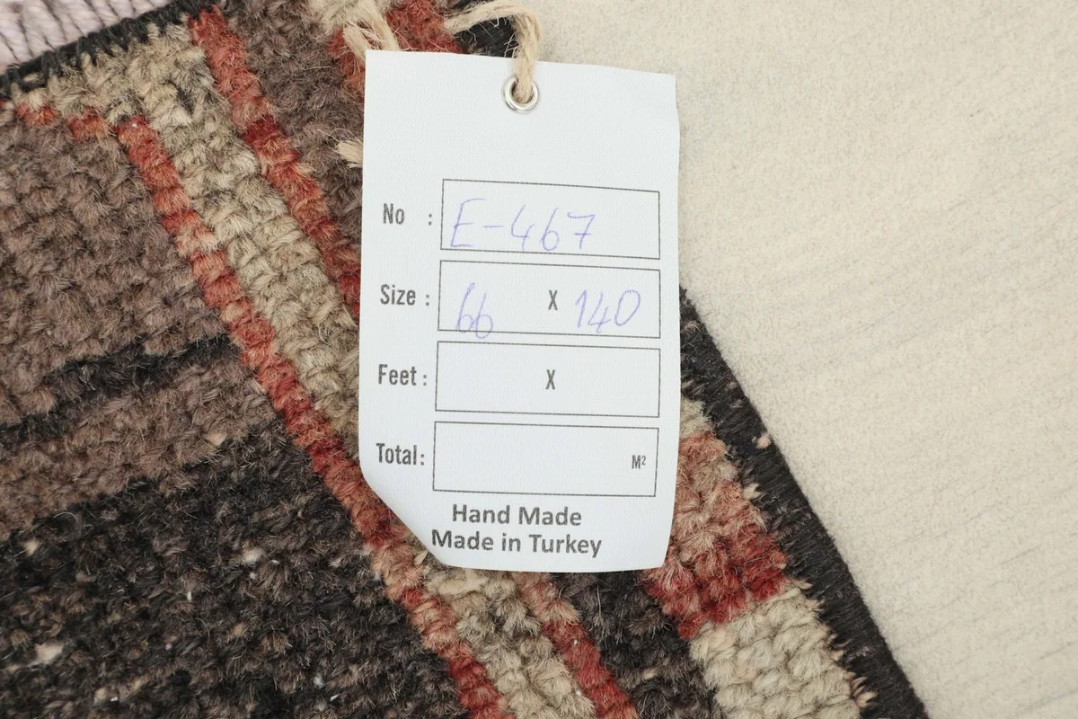 Close-up of the product tag, confirming 'Hand Made Made in Turkey' and size information.
