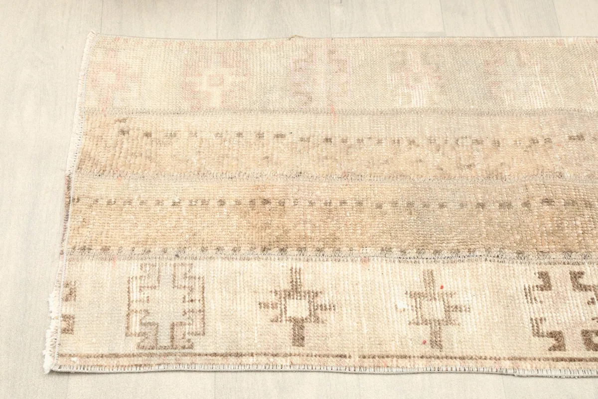 Close view of the right side of the rug, showing tribal patterns and border details