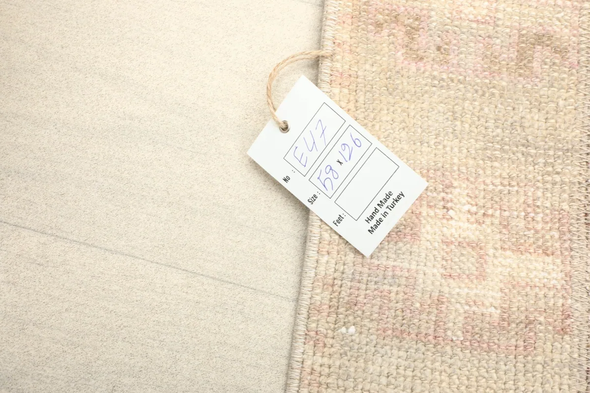 Close-up of the rug's label, indicating its size and origin from Turkey
