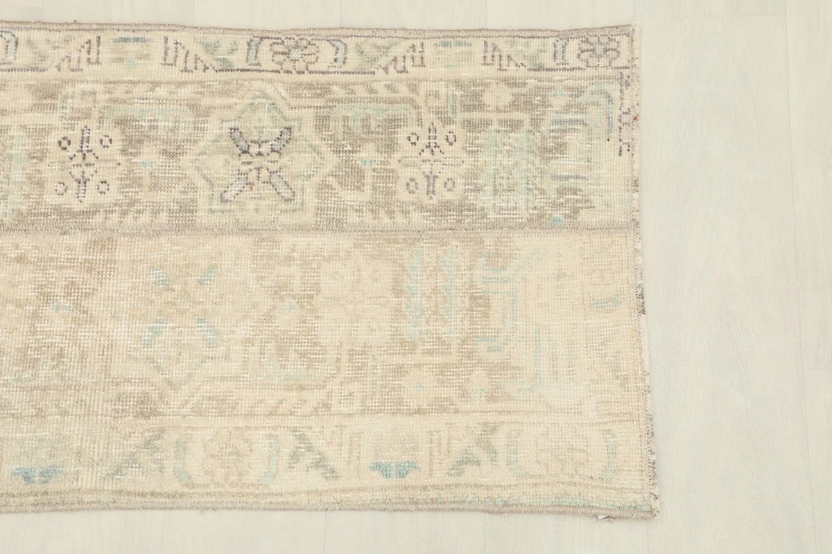 Close-up of the upper section, showing the intricate tribal motifs and color variations in the wool pile.