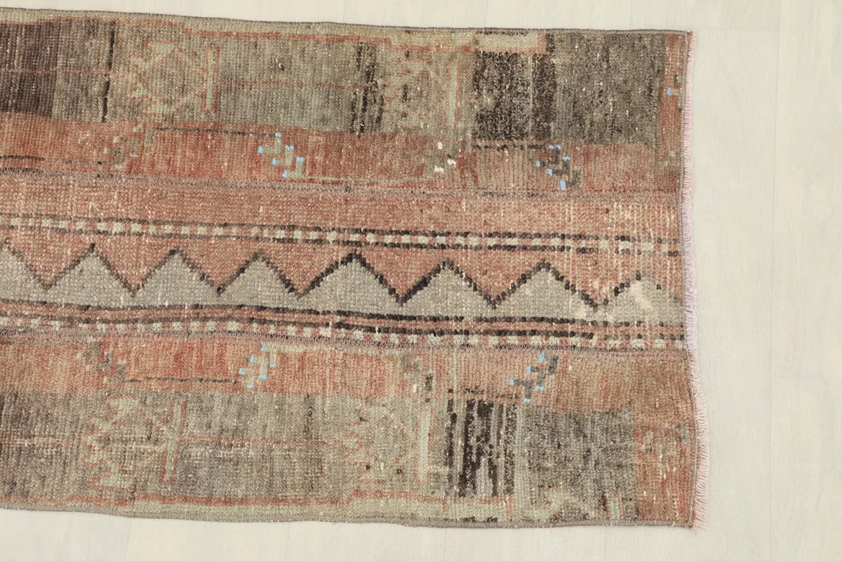 Close-up view of the rug's central zigzag pattern and surrounding tribal motifs
