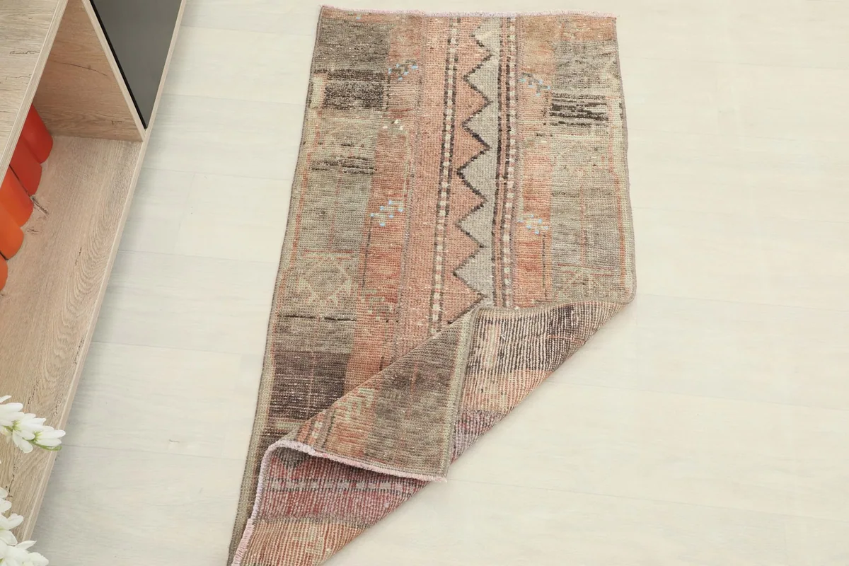 The rug partially folded, illustrating its flexibility and thickness