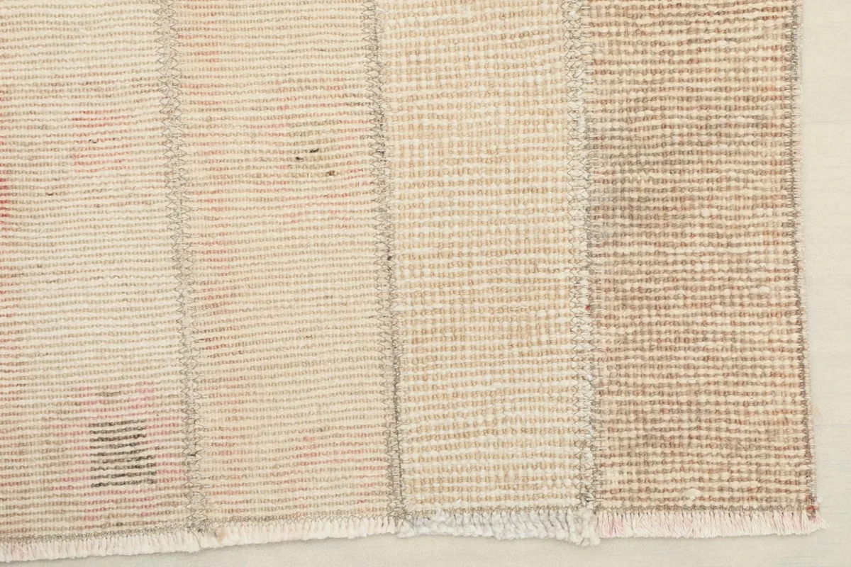 Close-up of the rug's edge and fringe, illustrating the hand-finished details.
