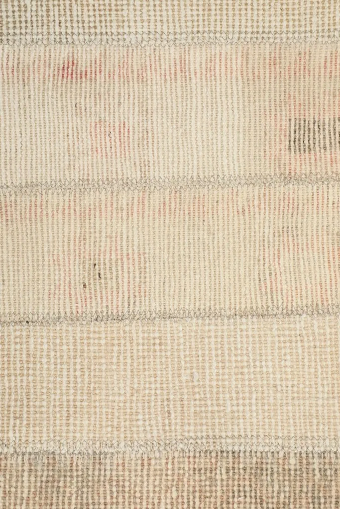 Detailed view of the low wool pile, showing the intricate knotting and color depth.