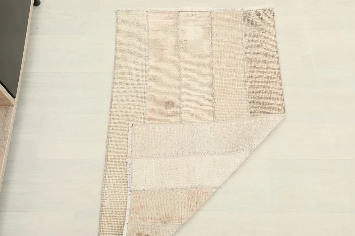 The rug partially folded, demonstrating its flexibility and construction.