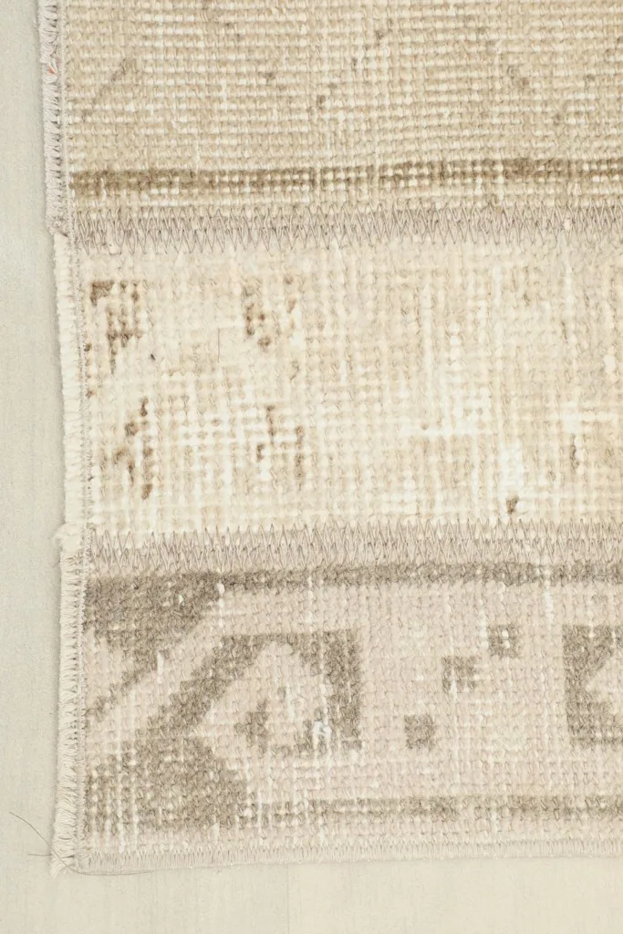 Corner detail of the runner rug, showcasing the finishing and border pattern.