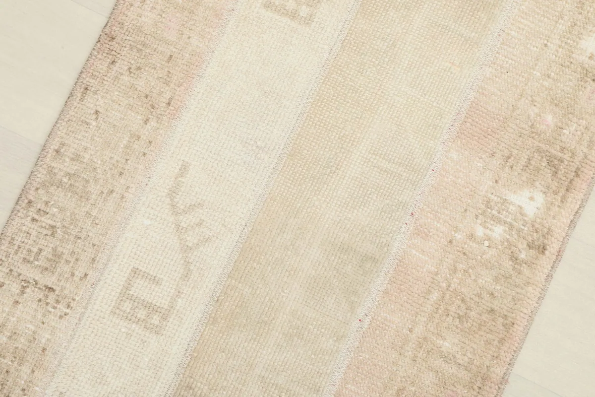 Oblique angle showing the different strips of wool creating the patchwork effect.