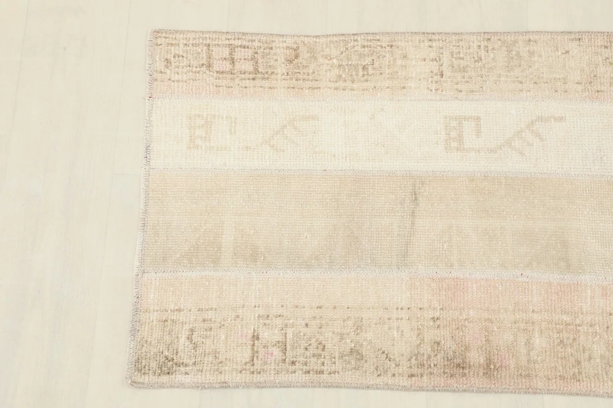 Detailed view of the rug's surface, showing the texture of the wool pile and color blending.