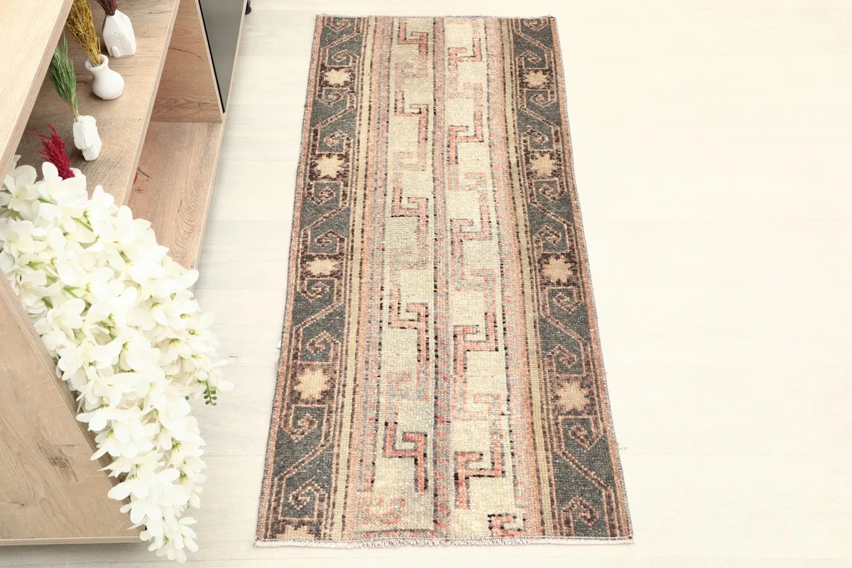 Overhead view of the hand-knotted wool rug, highlighting its full design and colors