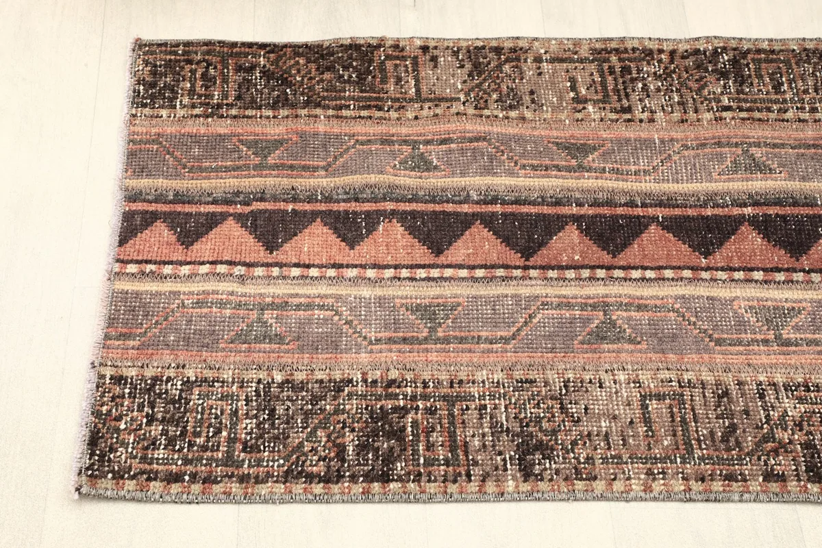 Angled shot of one end of the rug, showing the blend of colors and pattern variations.