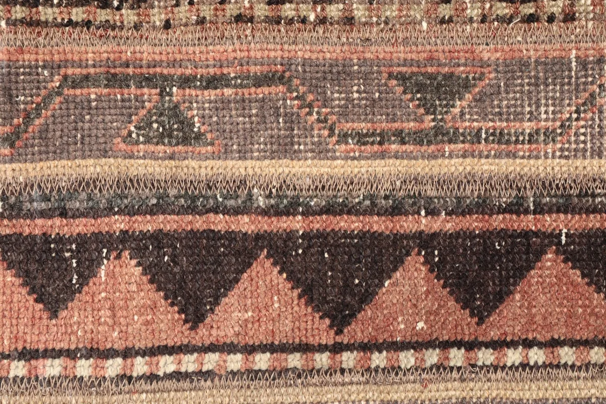 Detailed view of the central tribal patterns, including sawtooth and diamond shapes.