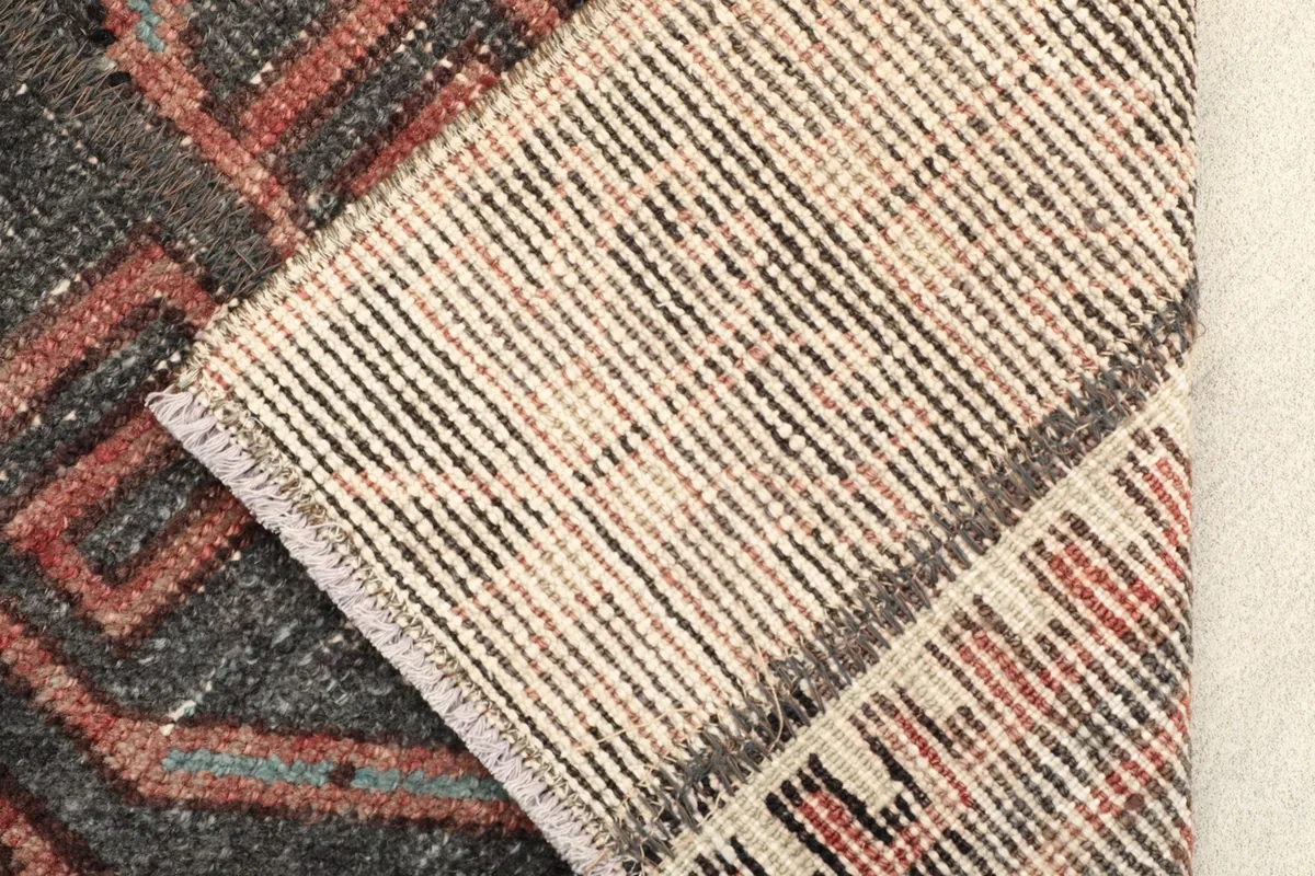 View of the back of the hand-knotted wool pile on cotton foundation, showing construction