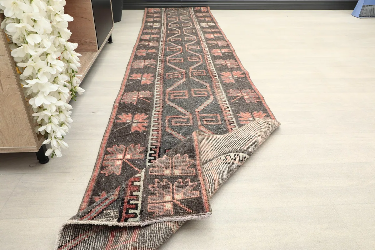 Runner partially folded, showcasing the flexibility and texture of the vintage wool material