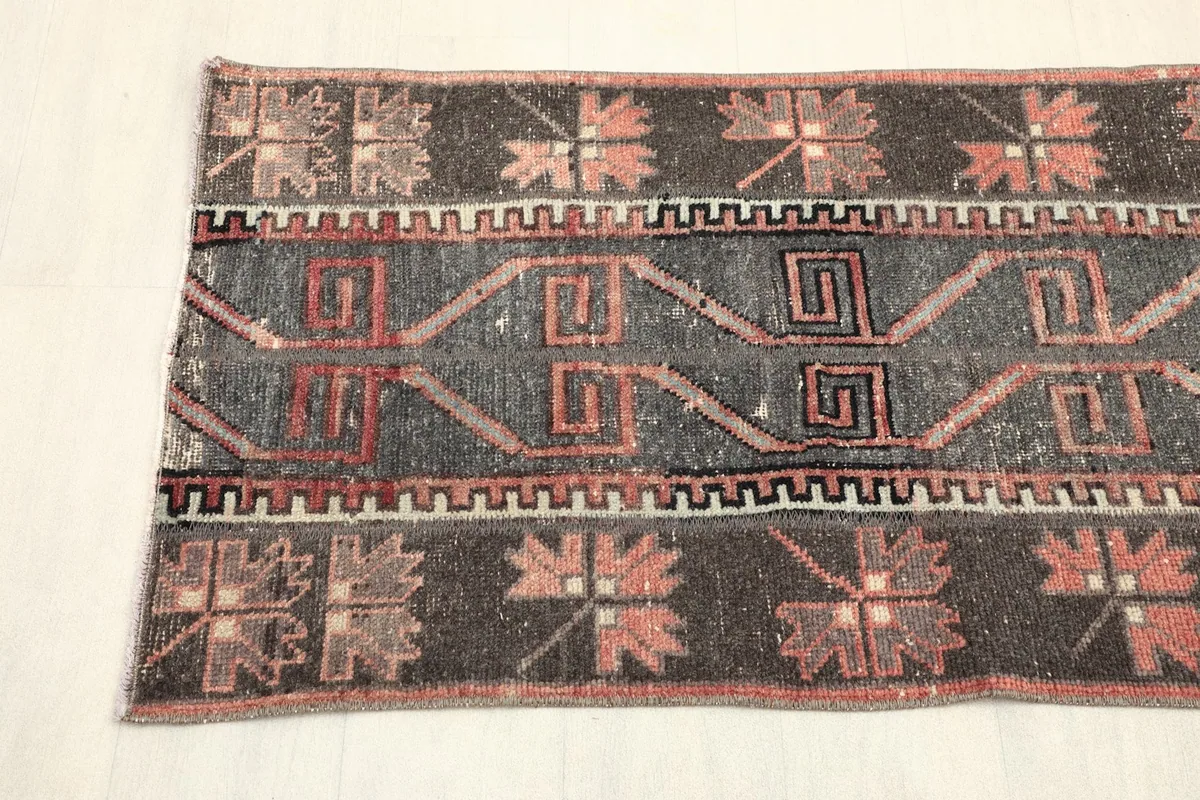 Overhead view showing a section of the runner with its repeating floral and geometric designs